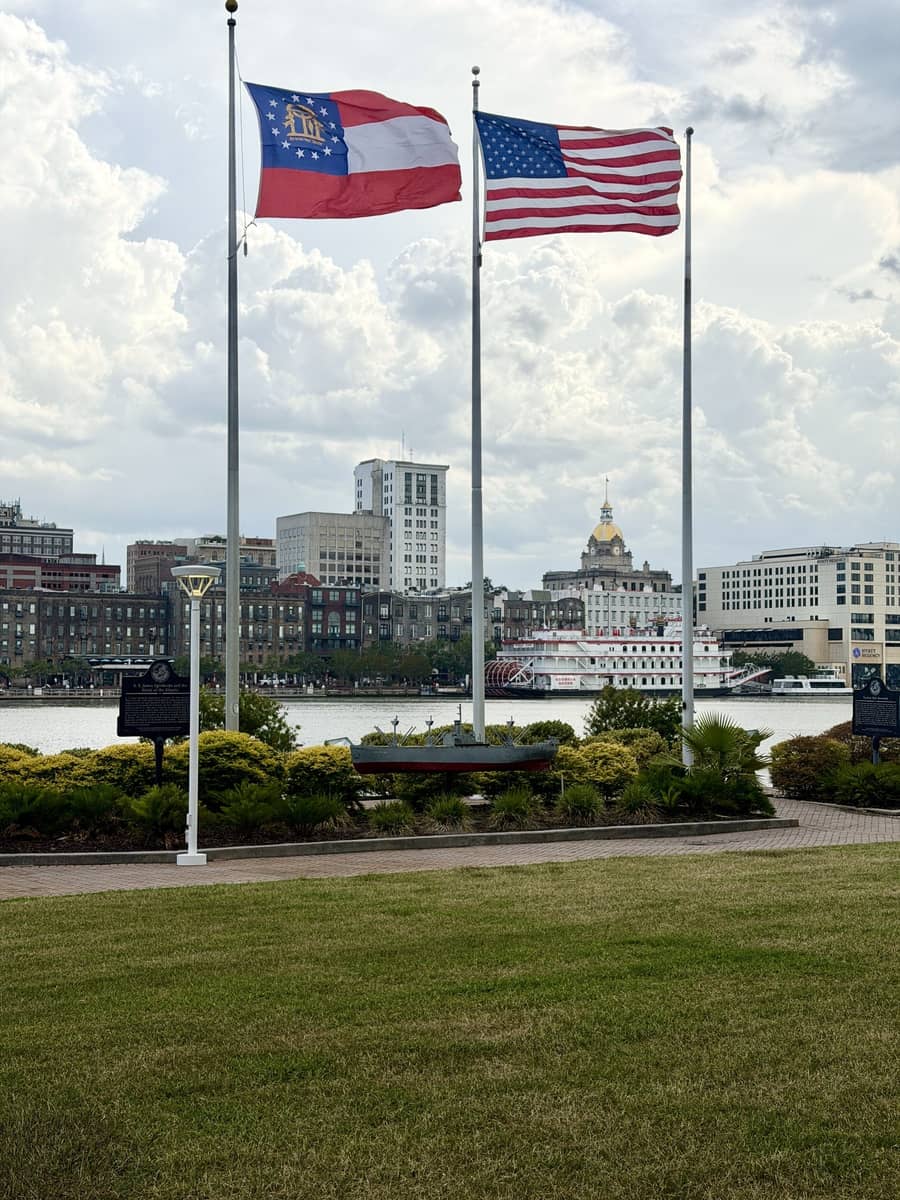 The Georgia and United States flags on the Savannah, Georgia riverfront overlooking the Savannah River